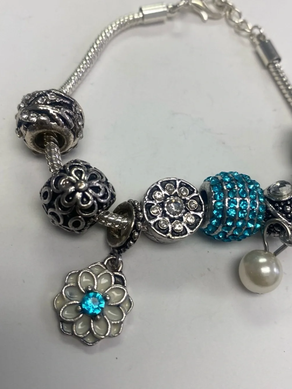 Silver tone Charm Bracelet with Turquoise Crystal and Pearl Accents